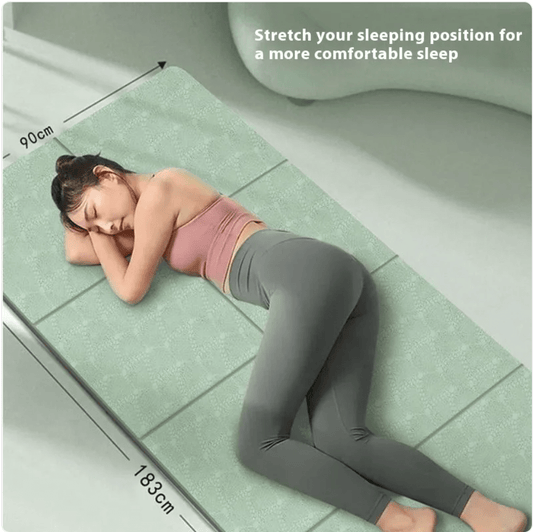 Woman lying on a green mattress with measurements indicated, promoting a more comfortable sleeping position.