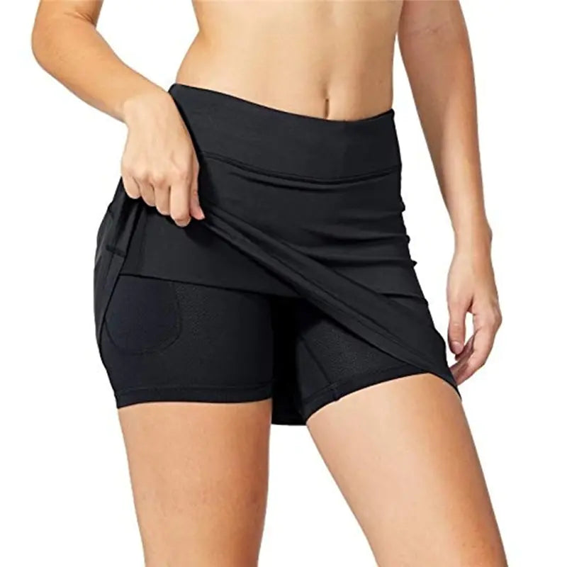 Black athletic shorts worn by a person on a white background