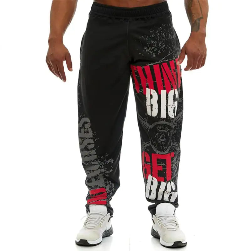 Black jogger pants with red and white text on a white background