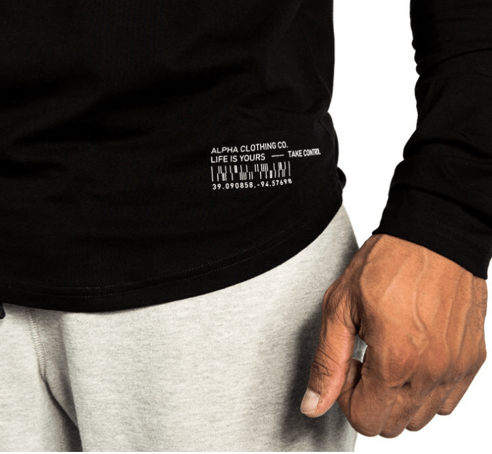 Black long-sleeve shirt with text and a hand wearing a ring on a white background