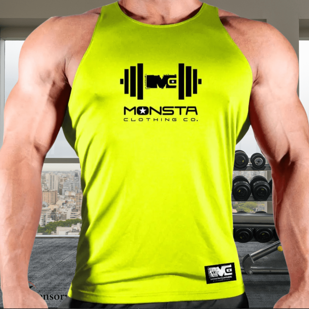 Person wearing a bright yellow tank top with 'Monsta Clothing Co.' logo in a gym setting.