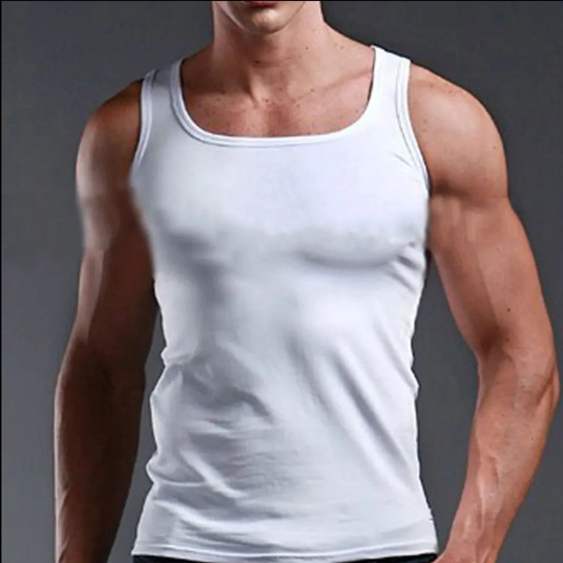 A white scoop-neck tank top worn by a cropped male model against a dark gray studio background.