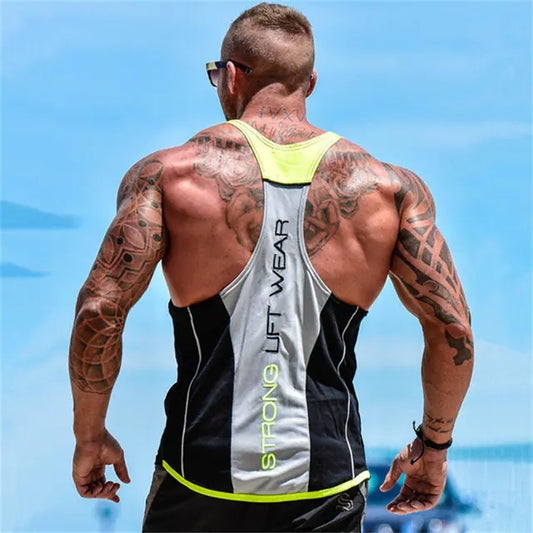 Man wearing a 'Strong Lift Wear' tank top with a clear blue sky background