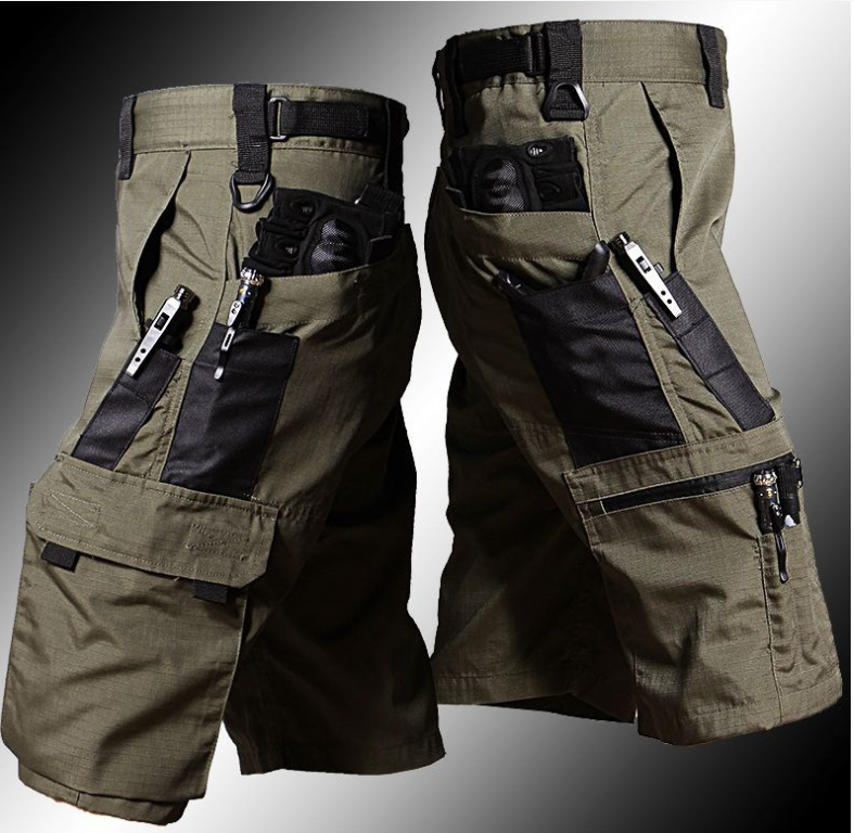 Pair of tactical shorts with multiple pockets and zippers on a gray background