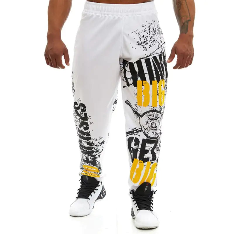 White pants with black and yellow graphics worn by a person on a white background