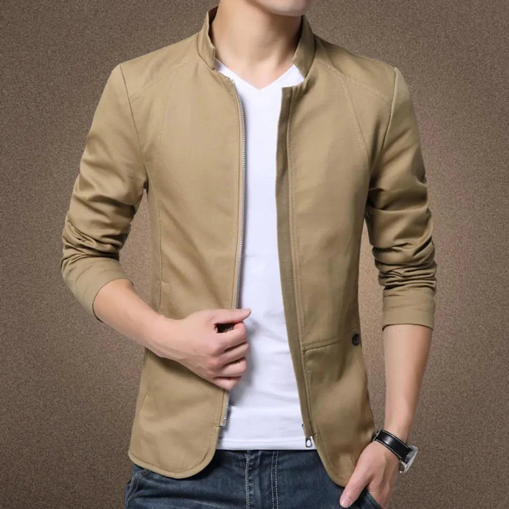 Beige jacket worn by a person on a brown background