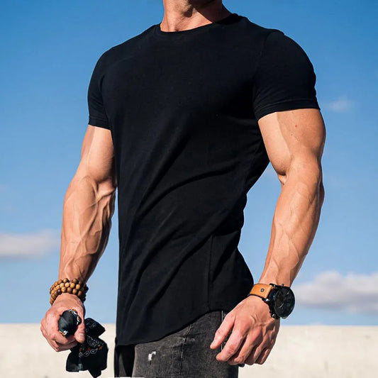 Person wearing a black t-shirt with a clear blue sky background