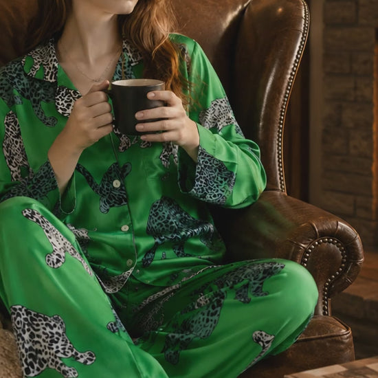 The Emerald Luxe Leopard Satin Lounge Set transforms evenings at home into something beautifully indulgent. Crafted from silky-soft stretch satin with an elegant emerald finish and striking monochrome leopard print, this two-piece set combines effortless sophistication with exceptional comfort.
